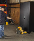 Person moving Beefy Tool Storage Cabinet With Bin Mounts DZ Includes 132 Bins 36 Inches Wide By 24 Inches Deep By 78 Inches High
