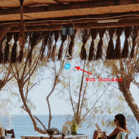 Plug In Hanging Wind Spinner Motor For Wind Chimes Sun Catchers And Baby Mobiles, visible in a beachside setting