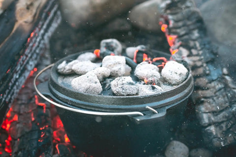 Pre Seasoned 2 Qt Cast Iron Dutch Oven With Flat Bottom For Stovetop And Campfire Use with lid retaining moisture on open flames
