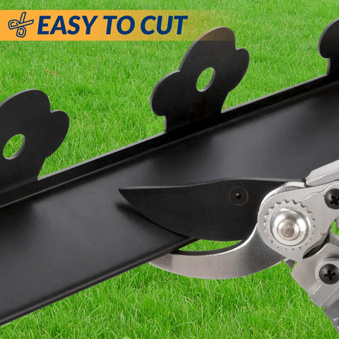 Close-up of 40 Ft No Dig Landscape Edging Kit with 60 Spikes, showing easy cut feature with scissors on black plastic border.
