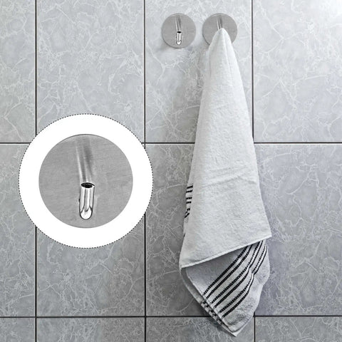 6 Pcs Stainless Steel Wall Hooks Zero Damage Install No Sweat Mount heavy duty hooks holding a towel on a tiled wall.