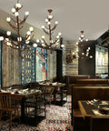 Top Shelf Chinese Magnolia Branch Chandelier in restaurant, modern pendant light with brown finish and bright bulbs.