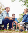 Family camping with Portable Tripod Folding Camping Stool, 14.6 Inch Seat, Lightweight Black outside a tent.