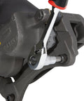 Performance Tool W1336 brake caliper hex bit set on a gray automotive brake caliper with a ratchet handle.