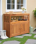 Weatherproof Acacia Wood Outdoor Storage Cabinet With Two Magnetic Doors And Three Level Storage in garden setting