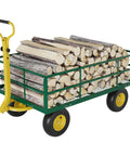22 Cu Ft Steel Tow Behind Dump Cart for ATVs and UTVs loaded with firewood, built tough heavy duty utility trailer with removable panel