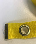 Close-up of bright yellow grommeted strip from 12 Pole Weave Pole Placer For Dog Agility Training Ensures Even Spacing Every Run