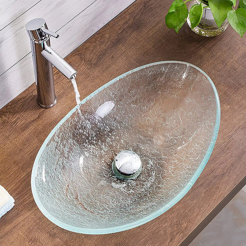 USZWBY Bathroom Vessel Sink Vanity Tempered Glass Vessel Bowl Sink Oval Transparent Countertop Sink Bowl Above Counter Sink with water flowing.