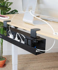 Under Desk Cable Management Tray Clamp-On No-Drill Metal Organizer For Cords And Wires installed on a desk holding power strips