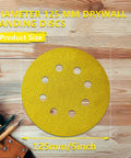 135 Piece 5 Inch Sanding Discs Set Eight Hole Round Hook And Loop Gold Pro Grade Grit on wooden background with tools