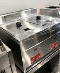 Kickstart Your Food Truck Trailer And Hot Dog Cart Venture With Commercial Mobile Kitchen Rig For Coffee Shop And Ice Cream Stand Business Hustle Dope Full Setup showing a stainless steel countertop with lids.
