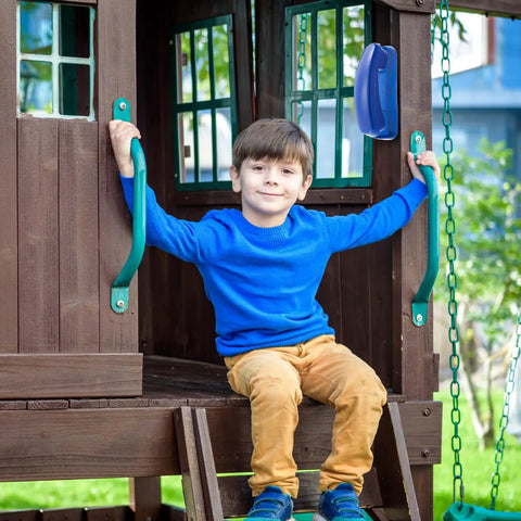 Child sitting in playhouse with Blue Pirate Ship Wheel Toy Telescope And Telephone Playground Accessories Bundle visible