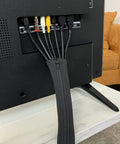 Zippered Cable Sleeve 24x4 Inches, 4-Pack Black, installed on TV cables, showing cord organization and protection.