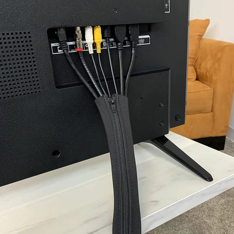 Zippered Cable Sleeve 24x4 Inches, 4-Pack Black, installed on TV cables, showing cord organization and protection.