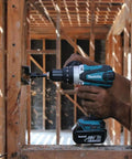 Rock Solid Eighteen Volt Cordless Hammer Driver Drill Kit Featuring Killer Torque Two Speed Gears And Hella Durable Ergonomic Build used on wood framing.