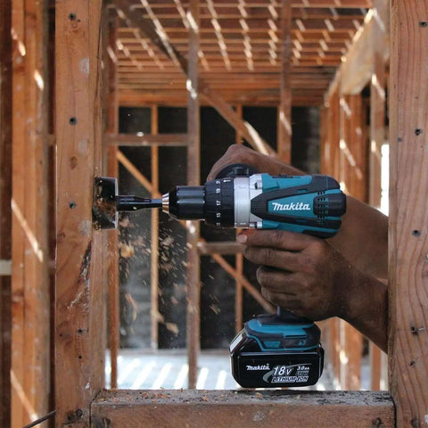 Rock Solid Eighteen Volt Cordless Hammer Driver Drill Kit Featuring Killer Torque Two Speed Gears And Hella Durable Ergonomic Build used on wood framing.