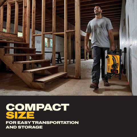 Man carrying Built Like A Tank Portable Table Saw Equipped With Sturdy Rolling Cart and Premium Steel Blade in a construction site.