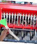 Adjustable Seeder Replacement Tube held in front of farm seed drill, showing easy install for wheat and corn seeding.
