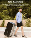 Man transporting a 30 Inch Electric Smoker For Outdoors With Built In Meat Probe And Clear Viewing Window, in patio garden setting.