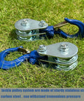 Badass Heavy Duty Double Pulley Snatch Block With Hook 1 Ton Load Rating, galvanized steel, close-up on grass.