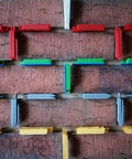 Pro Grade Leveling And Spacing Shims Kit With 150 Pcs U Shaped Tile Spacers 1mm 2mm 3mm 4mm 5mm 6mm For Window And Door Installation And Woodworking By Left Bridge displayed on a brick wall.