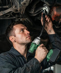 Mechanic using Secure Socket Locking 360 Degree Flexible Wrench Extension Rod For Workin In Tight Spots under a vehicle.