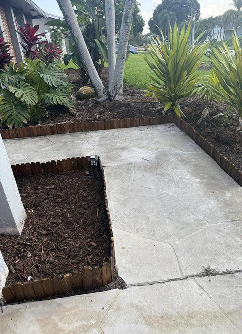 Garden Edging Kit With Rustic Picket Panels For Flower Beds And Landscape Borders Charred Wood Construction For Moisture And Rot Resistance 5.9 Inch High By 47 Inch Long 1 Pack installed around flower bed