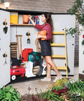 Woman organizing a garden shed with Heavy Duty Magnetic Mop And Broom Holder Rack With No Slip Wall Mount Tool Organizer installed