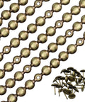 Heavy Duty Brass Upholstery Tack Strips Serving Dapper Decorative Nailhead Trim For Couch Headboard And Swivel Chair Furniture Upgrade To Amp Up Your Interior Design Refresh close-up of stacked brass tack strips and decorative nailheads.