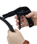Hands using Zip Tie Gun And Cable Tie Install Tool With Adjustable Tension No Fuss Built In Cutter For Easy Cable Management Works With Nylon Ties Up To Quarter Inch Black on cables.