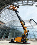 Heavy Duty Industrial Vacuum Suction Lifter For Glass And Stone Panels hauls massive glass sheets at a construction site.
