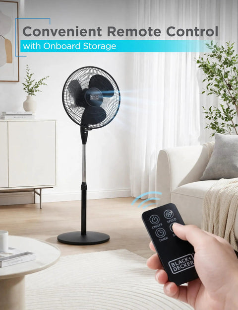 16 Inch Stand Fan With Pedestal Base Height Adjustable Remote Control in room, viewed with remote control in hand.