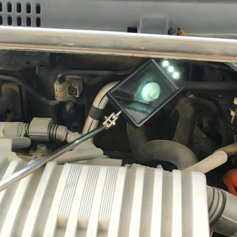 Telescopic LED Inspection Mirror With 360 Degree Rotation For Cars And Machinery in engine bay with flexible metal handle, 3 LEDs.