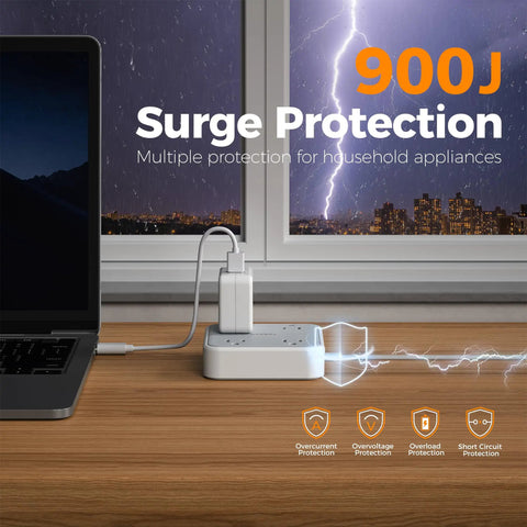 Extension Cord 10 Ft Long Surge Protector Power Strip With 4 Outlets 3 USB Ports Including USB C 900 Joules Protection Flat Cable For Home Office Dorm Room Desktop Charging Station Grey shown on a desk with laptop and charging devices.