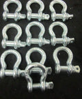 Multiple Bow Shackle Anchor Pin D Ring Recovery Tow Chain for Marine Boats 2 Ton Heavy Duty Half Inch Diameter arranged on black.