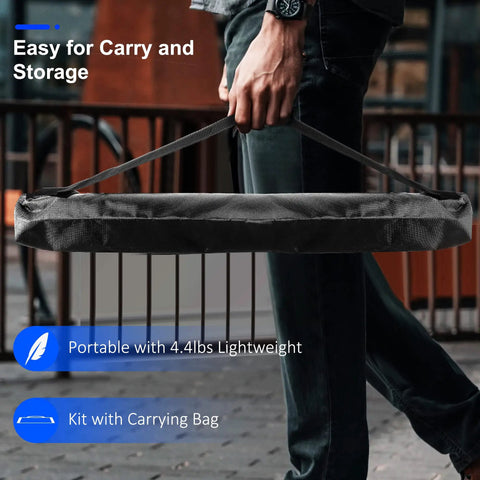 Person carrying Go To Rechargeable LED Work Light With Stand And Detachable Tripod in included carrying bag