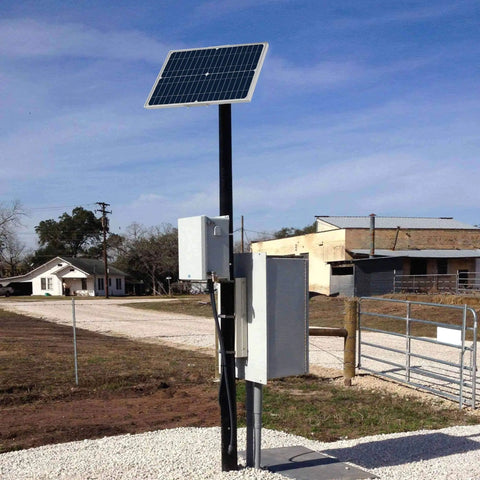 12V 30W Solar Battery Trickle Charger And Maintainer With Waterproof 30 Watt Solar Panel with pole mount in outdoor setting