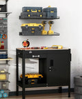 Heavy-Duty Wall Mounted Garage Shelves 2 Pack Metal Storage Racks Black 23.5 By 12 Inches Durable Powder-Coated Steel Shelves Space Saving Organizer for Workshop Shed and Shop, mounted above workbench holding tools and cases.