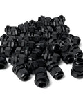 One Half Inch NPT Strain Relief Nylon Cord Grip Cable Glands Black Plastic Grommet 100 Pack Pro Grade shown piled together
