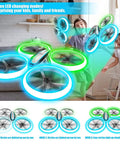 Kids Drone With Altitude Hold And Headless Mode Quad Copter With Neon Blue And Green Lights in living room with children playing