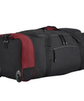 Travelers Club 32-inch expandable rolling duffel bag, black with red side panels, on wheels