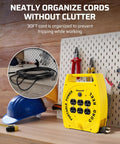 30 Ft Retractable Extension Cord Reel With 4 Grounded Outlets on workbench, yellow, coiled cord near tools
