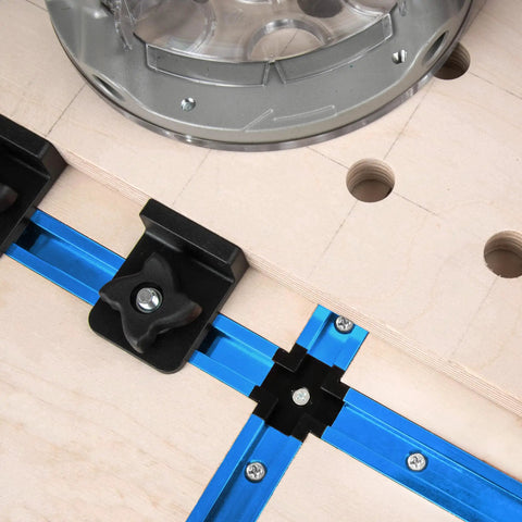 Close-up of Six Pack Aluminum T Track Intersection Kit for 3/4 Inch by 3/8 Inch Universal Double Cut T Track on woodworking table