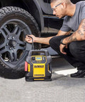 Person using Legit Replacement 14.5V DC Charger Car Adapter Compatible With Dewalt DXAEPS14 Jump Starter on tire.