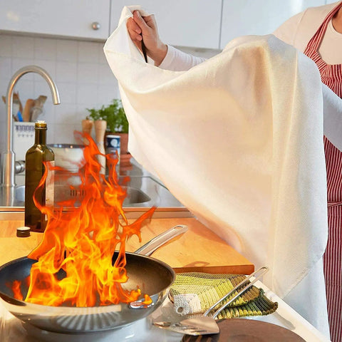 Person using Heavy Duty Fiberglass Fire Blanket 3.9 By 5.9 Feet For Emergency Survival And Kitchen Fire Safety Flame Retardant Heat Insulation Made For Grills Cars Camping And Home Use 5 Pack to extinguish kitchen fire