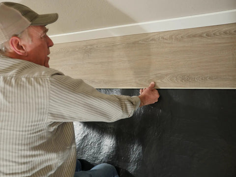 Heavy Hitter Underlayment Roll for Luxury Vinyl Plank Laminate and Engineered Wood Floors, 50 square foot spool used for installation.