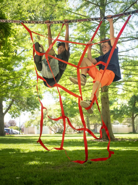 Kids climbing Ninjaline Obstacle Course Kit For Backyard Ninja Warrior Training 56 Ft Deluxe Set With 9 Hanging Obstacles outdoors