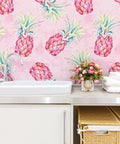 Bold Pink Pineapple Peel And Stick Wallpaper With Watercolor Pineapple Pattern in bathroom setting, 17.7x354 inch vinyl roll.