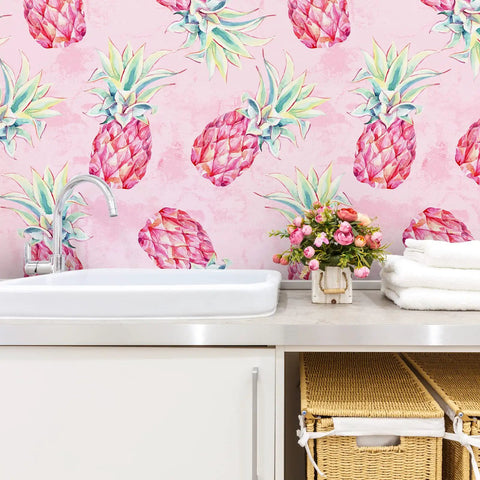 Bold Pink Pineapple Peel And Stick Wallpaper With Watercolor Pineapple Pattern in bathroom setting, 17.7x354 inch vinyl roll.