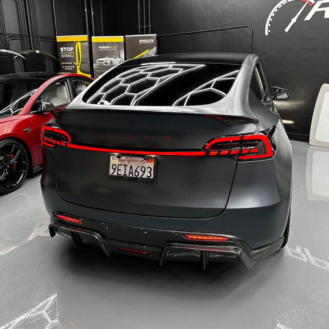 Mean Looking Sequential Led Tail Lights And Trunk Light Bar For Tesla Model 3 And Y Gen Two installed on a grey Tesla Model Y.